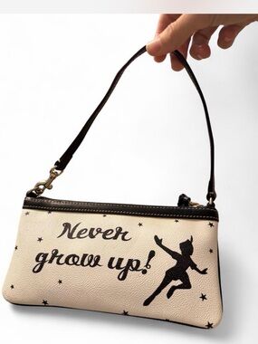 Dooney & Bourke Never Grow Up! Disney Beige and Black Wristlet Bag